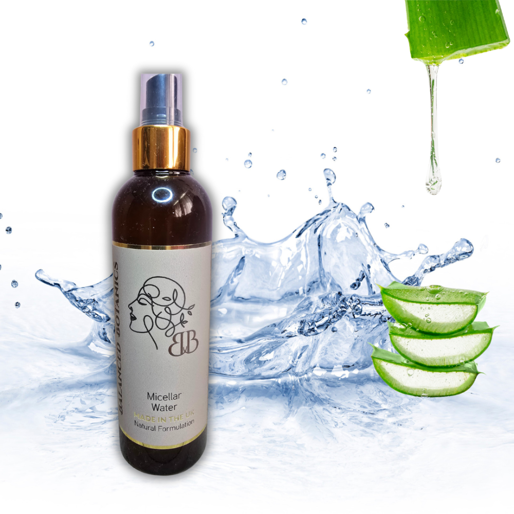 Bottle of micellar water with aloe vera slices and water splash on a white background