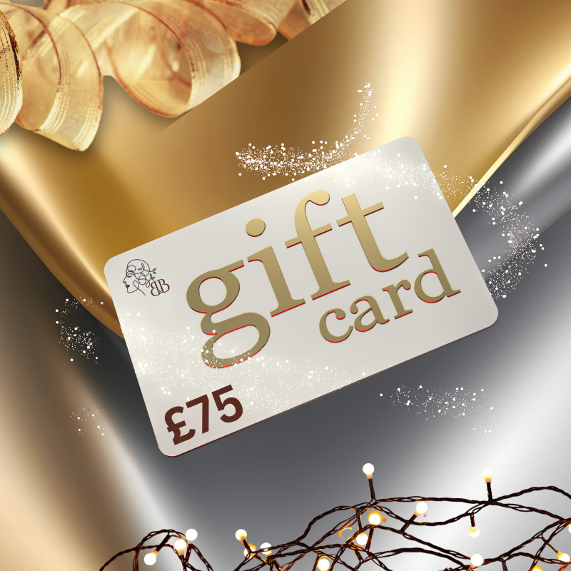 Gift card with £75 value on a decorative background with gold ribbon and lights