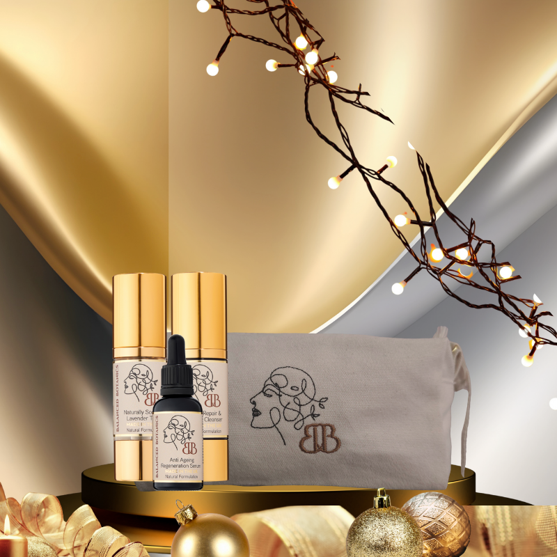 Cosmetic products with a decorative pouch on a gold surface, featuring warm lighting.