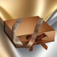 Gold gift box with a ribbon on a gradient background